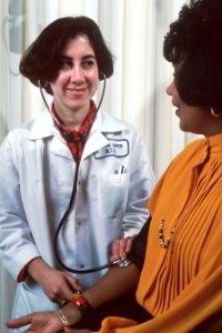 Nurse takes a patient's blood pressure photo