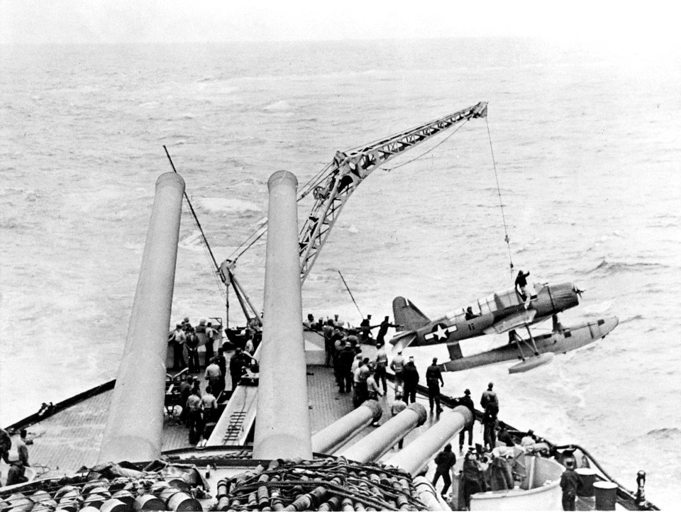 OS2U is hoisted aboard USS Nevada (BB-36) c1944