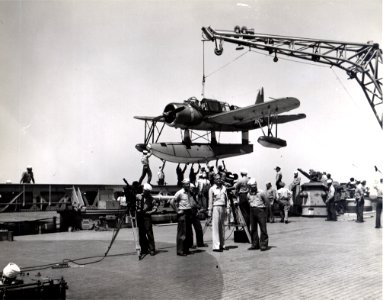 OS2U on BB-63 crane