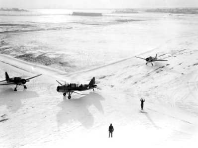OS2U Kingfishers taxi into position for launch in February 1943 photo