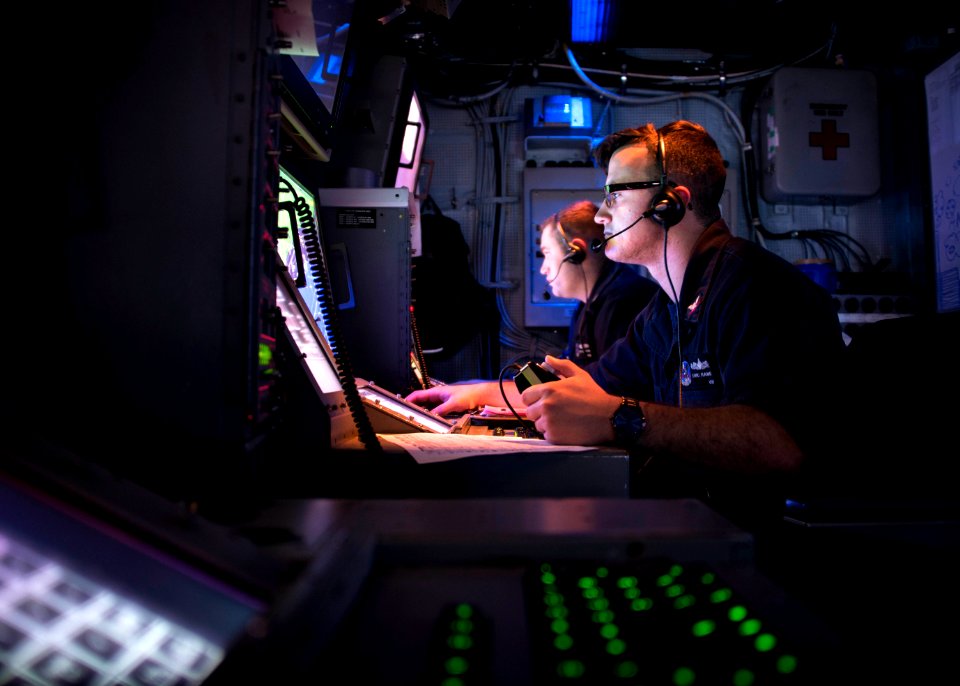 OS3 Eric Rand scans for air contacts aboard USS Iwo Jima, November 2017