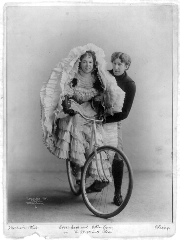 Oscar Eagle standing alongside of Esther Lyon (on bicycle), in A Briliant Idea LCCN2004678707