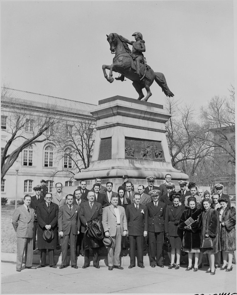 Oscar Ivanissevich, Ambassador from Argentina, poses with a group of people by the statue of South American patriot... - NARA - 199600