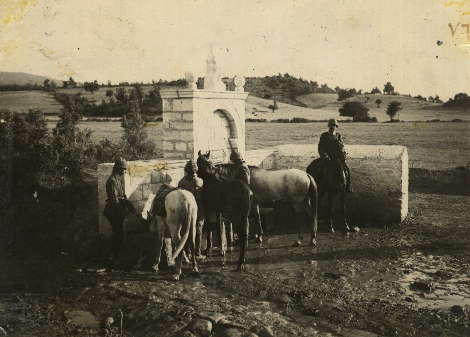 Ottoman cavalryman leading hourses to the water fountain