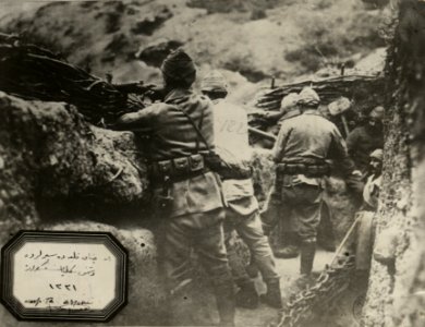 Ottoman soldiers waiting in trench photo