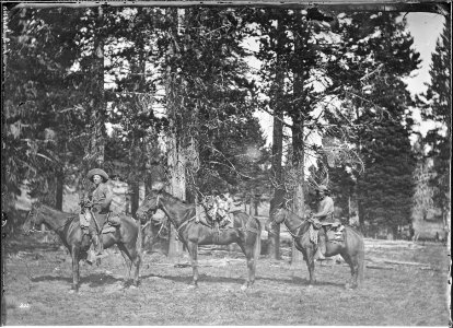 Our hunters, Jose and Joe Clark, returning from a successful hunt, with pack animal laden with elk meat. - NARA - 516721