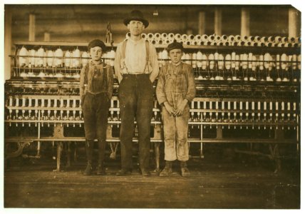 Overseer and two of the doffer boys, Charles Hennessy and John Douglass in Avondale Mills. Noon hour. Overseer said, 'we've got 30 of 'em.' LOC cph.3b21310