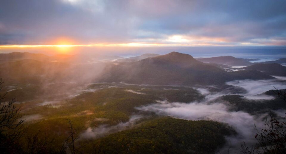 Fog sunset mountains photo