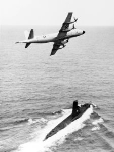 P-3 Orion flies over USS Chopper (SS-342) in the 1960s