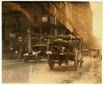 P.M. Delivery boys on Tremont Street, 'getting a hitch.' LOC nclc.03990