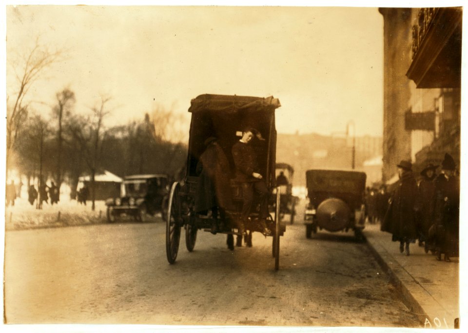 P.M. Delivery boys on Tremont Street, 'getting a hitch.' LOC nclc.03991