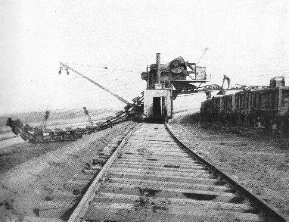 P417a The excavator at work, digging a channel for drainage