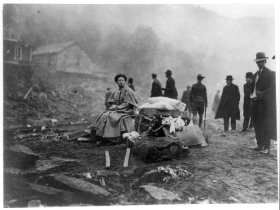 Pa. - Austin - Woman sitting by her few salvaged household effects during the Flood of 1911 LCCN2006690010