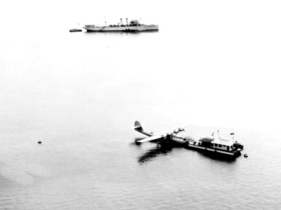 PAA Martin 130 moored to the Pan American floating dock in Manila Bay, Philippines, circa in 1936 (NH 78012)