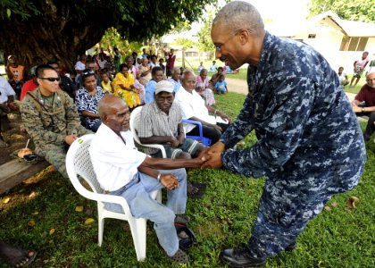 Pacific Partnership commander meets oldest man in Hog Harbor 110504-N-YM863-554