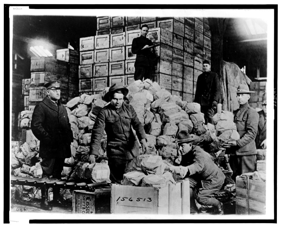 Packing shipment of Matzoths (i.e. matzos) for the 77th Division for men of Jewish faith in the A.E.F. for the Passover Holiday, at Warehouse -40, Q.M.C. Depot, St. Denis (France) - Signal LCCN00652973