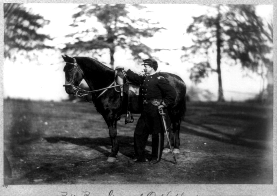 O.H. Hart, full-length portrait, standing, left profile, in uniform, alongside horse LCCN96509187