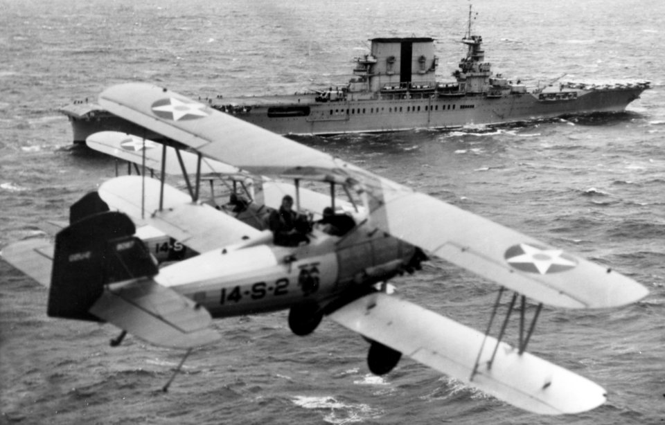 O2U-2 Corsairs of VS-14M fly over USS Saratoga (CV-3), circa 1930 (NH 94899)