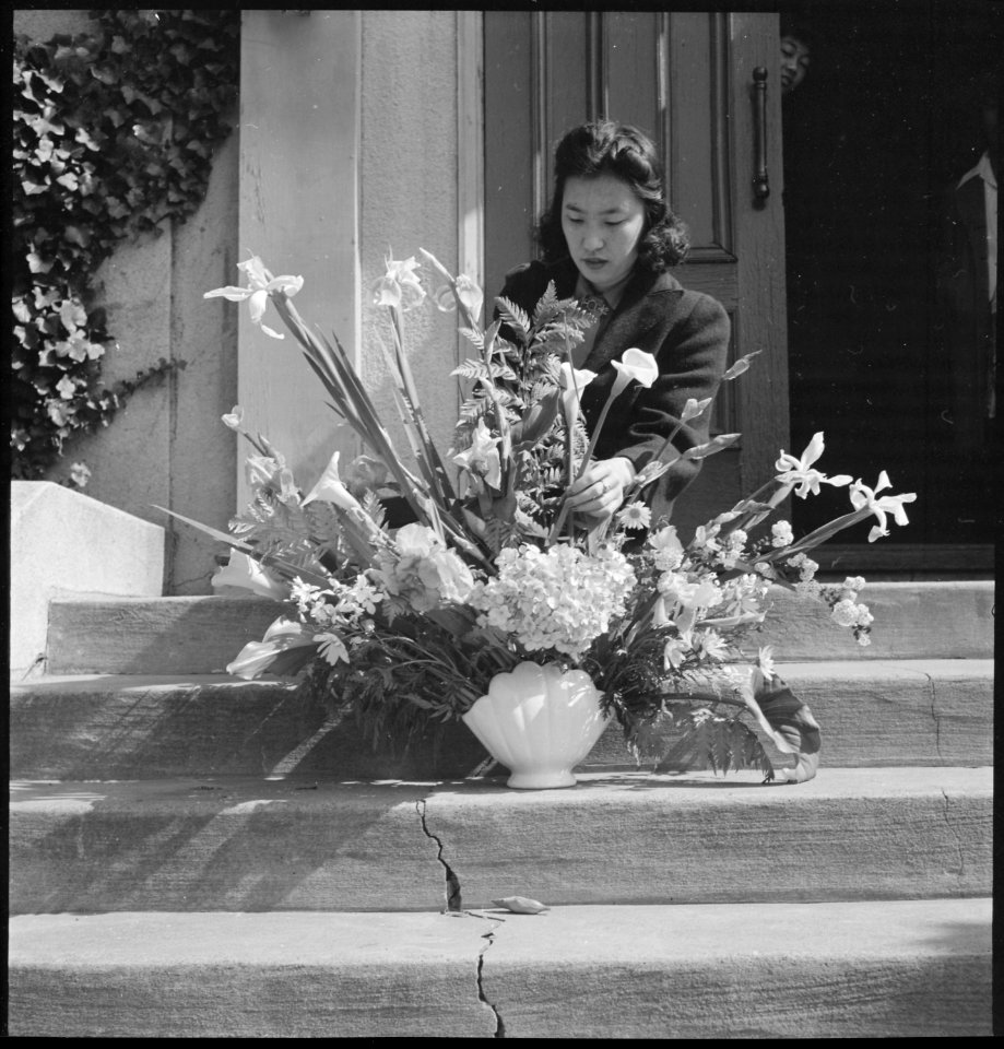 Oakland, California. Arranging flowers for alter on last day of service at Japanese Independent Con . . . - NARA - 536433