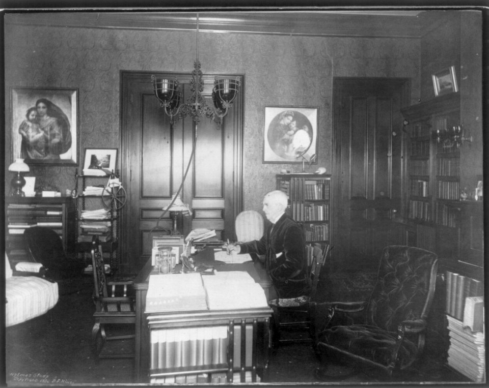 Oliver Wendell Holmes, 1809-1894, half-length portrait, seated at desk, facing left, in his study LCCN2005685764
