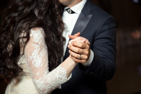 Groom bride holding hands photo