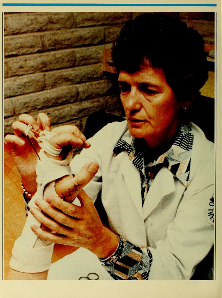 Occupational therapist adjusts a handsplint