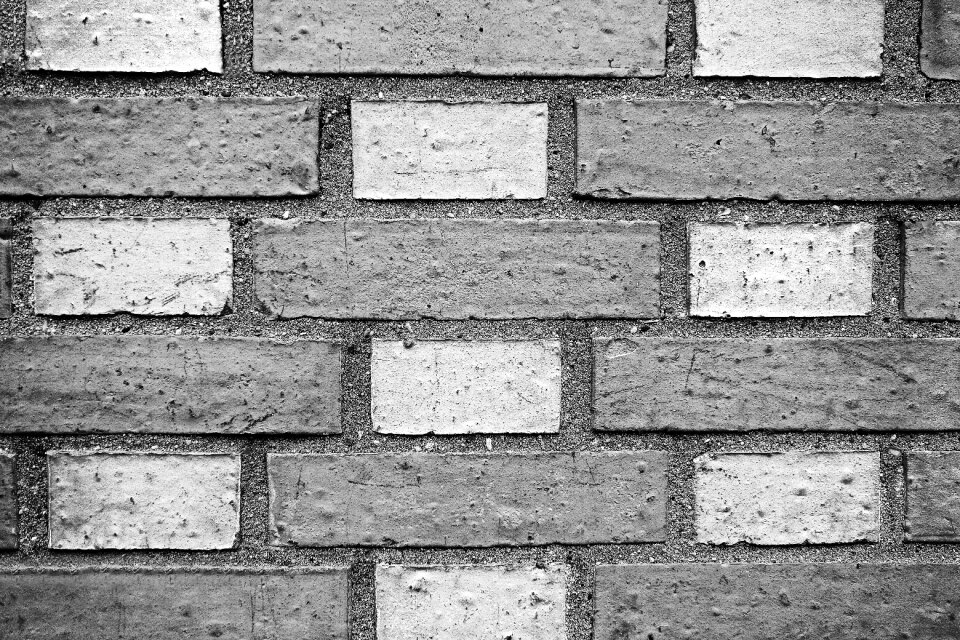 Masonry checked white and gray checked brick wall