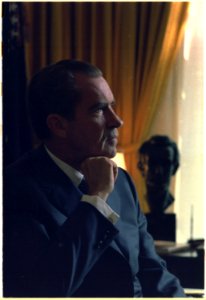 Offcial Presidential portrait. Profile shot of Richard M. Nixon seated in the oval office. - NARA - 194328