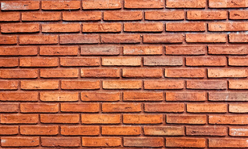 Orange brick masonry wall photo