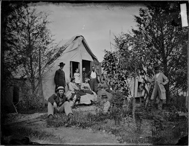 Officer's family on visit to quarters - NARA - 529306