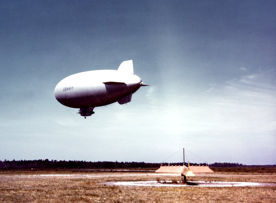 A U.S. Navy K-class blimp flies low over a naval air station, circa in 1943-1944 (80-G-K-13733)