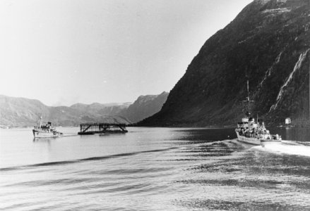 A German Tug towing camouflage float into position to protect the German battleship Tirpitz, at Fættenfjord , Norway 1942. (50050504201)