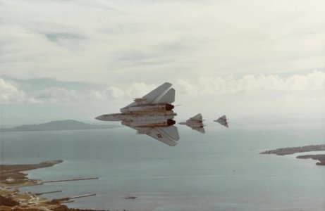 Grumman F-14 Tomcat's Peel off in formation over a unknown harbor August 1979. (50978402968)