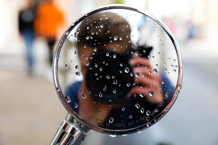 Motor bike rear view mirror photographer