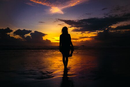 Walking alone sunset photo