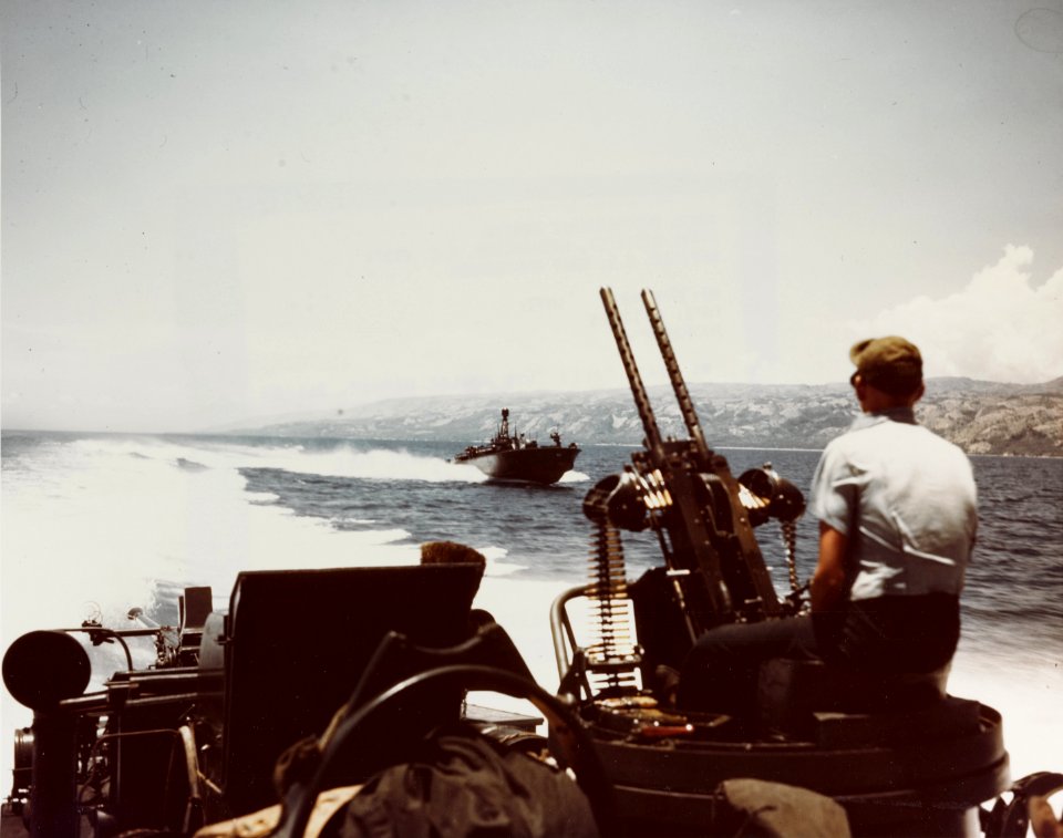 PT boats speed through Polloc Harbor, Mindanao, while supporting landings there, boat in background appears to be PT-150 April 17th 1945. (50250595783)