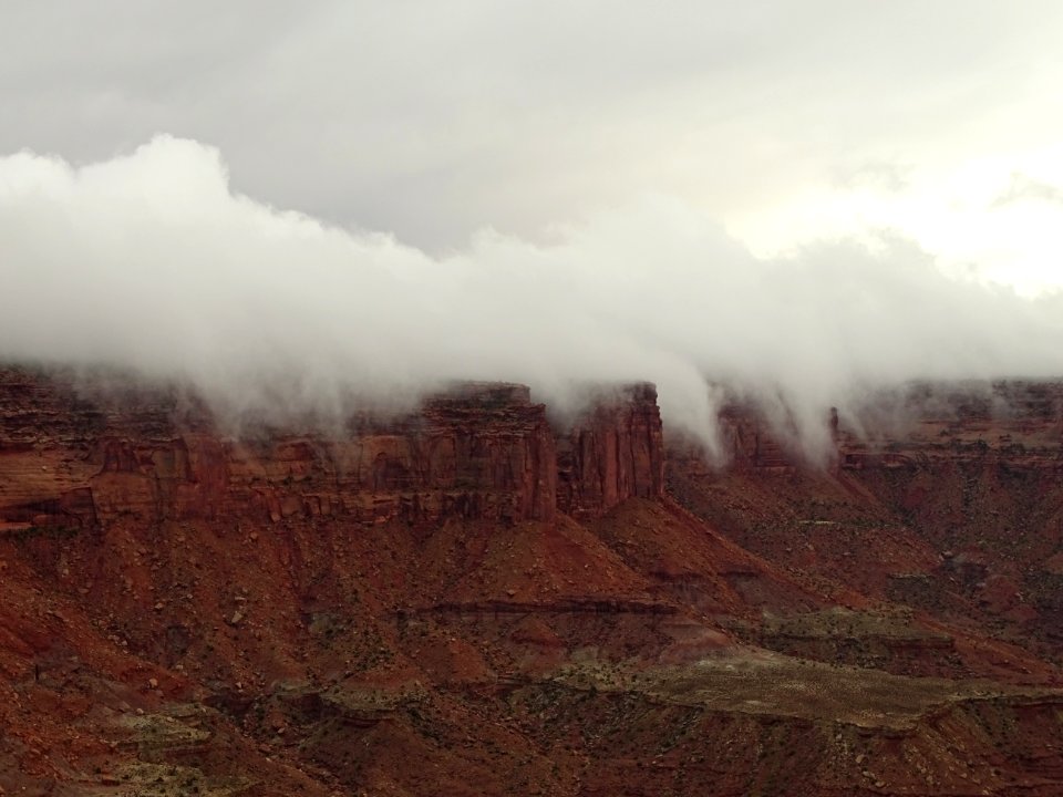 Rolling fog down sandstone cliffs (51388447826)