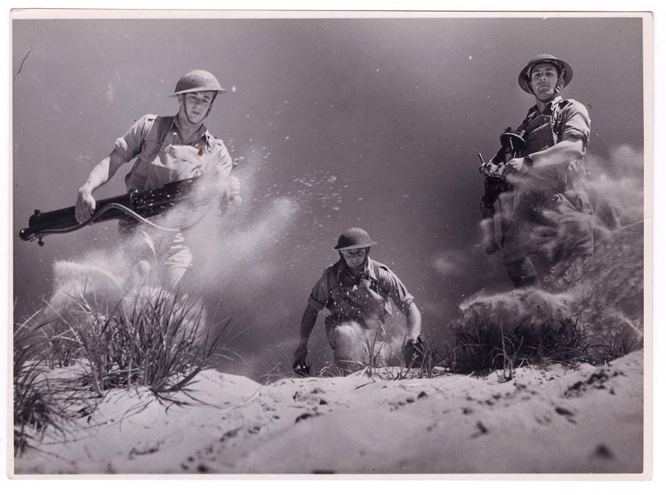 Soldiers running with machine guns, ca1940 (28144483070)