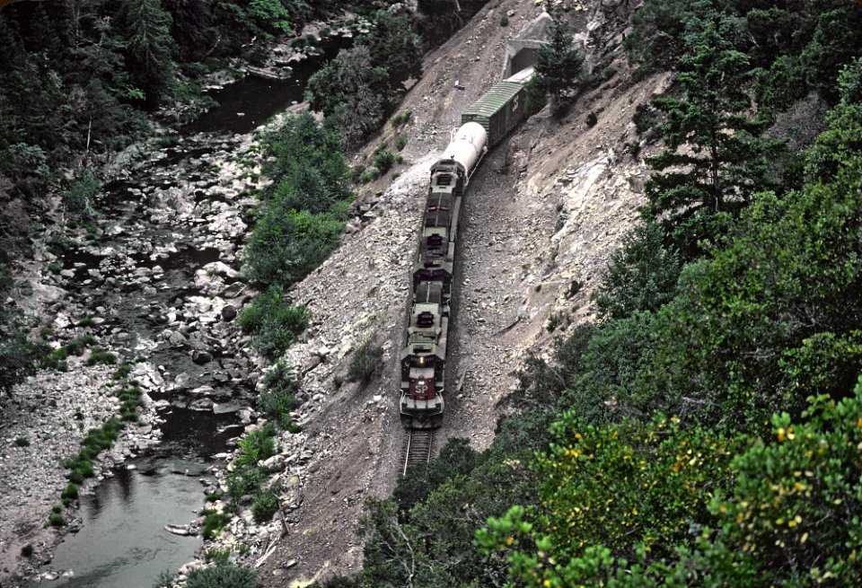 SP 8233, 8502, and 8234 Tunnel Motors exiting Tunnel 4 in Cow Creek Canyon, OR on July 30, 1982 (32778263530)