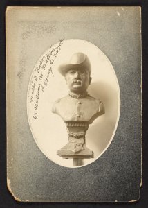 A three-quarter view bust representation of President Roosevelt in uniform of Colonel of Rough Riders, mounted on a pedestal LCCN2013651269