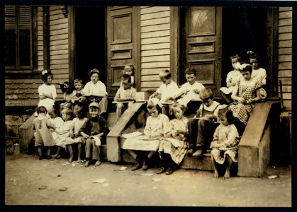 A typical sight. Family and neighbors working on tags on door steps of Mrs. McCarthy, 88 Marcella Street, Roxbury, Mass. See Home Work report. LOC nclc.04253