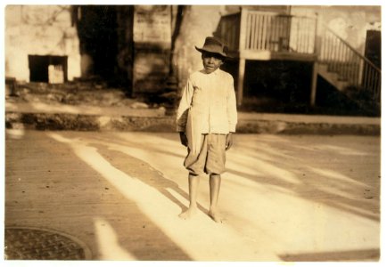A typical San Antonio newsboy. Nine years old. Youngsters like this abound, here and in many other Texas cities. Some sell early in morning and late at night. LOC nclc.03872 photo