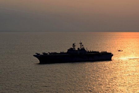 A U.S. Army AH-64D Apache Longbow helicopters assigned to the 4th Aerial Reconnaissance Battalion, 2nd Combat Aviation Brigade, 2nd Infantry Division lands aboard the amphibious assault ship USS Bonhomme Richard 140411-N-BJ178-394