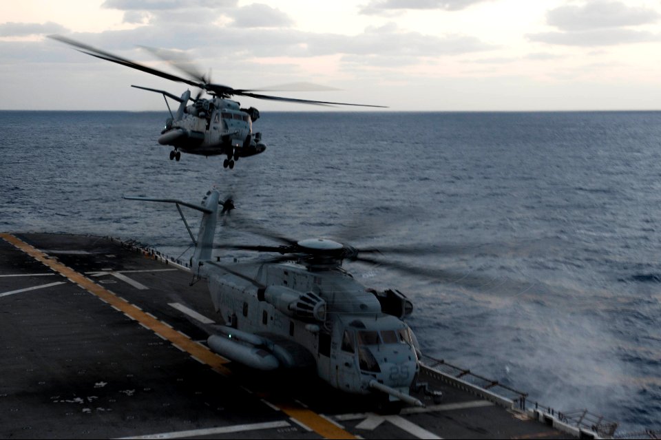 A U.S. Marine Corps CH-53 Super Stallion helicopter assigned to Marine Medium Tiltrotor Squadron (VMM) 265 takes off from the amphibious assault ship USS Bonhomme Richard (LHD 6) in the East China Sea March 10 140310-N-LM312-076