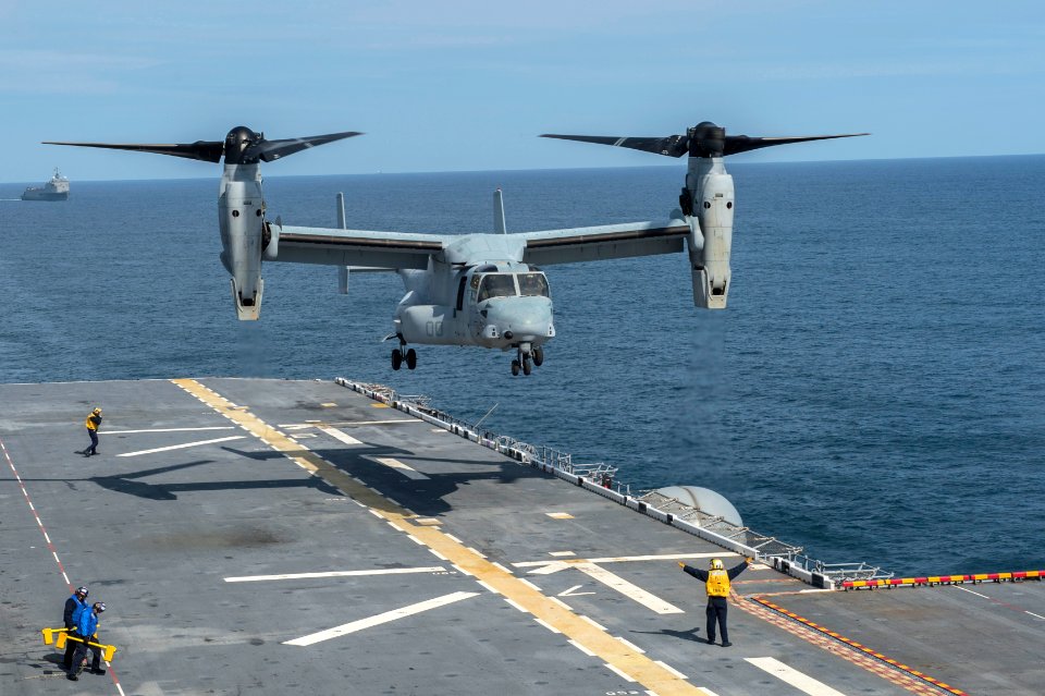 A U.S. Marine Corps MV-22 Osprey tiltrotor aircraft attached to Marine Operational Test and Evaluation Squadron (VMX) 22 prepares to land on the amphibious assault ship USS America (LHA 6) in the Pacific Ocean 140827-N-MD297-063
