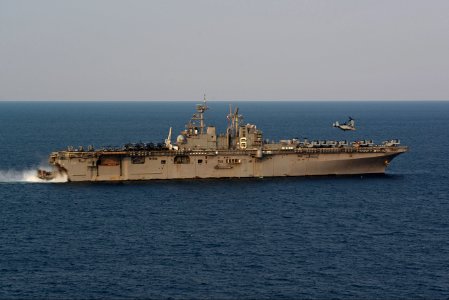 A U.S. Marine Corps MV-22B Osprey tiltrotor aircraft assigned to Marine Medium Tiltrotor Squadron (VMM) 265 takes off from the amphibious assault ship USS Bonhomme Richard (LHD 6) as a landing craft, air 140411-N-BJ178-383