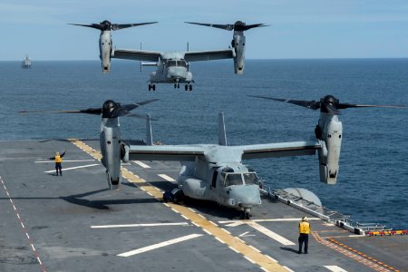 A U.S. Marine Corps MV-22 Osprey tiltrotor aircraft attached to Marine Operational Test and Evaluation Squadron (VMX) 22 prepares to land on the amphibious assault ship USS America (LHA 6) in the Pacific Ocean 140827-N-MD297-087