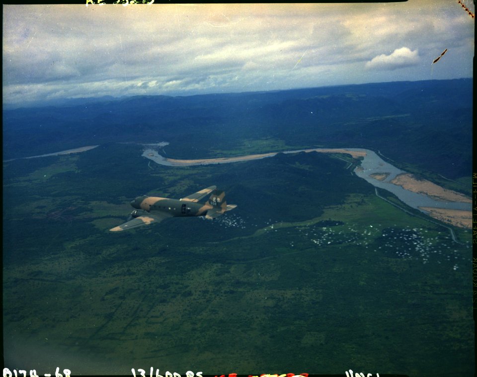 A U.S. Air Force C-47 releases psychological warfare leaflets near Nha Trang, South Vietnam. - NARA - 542339
