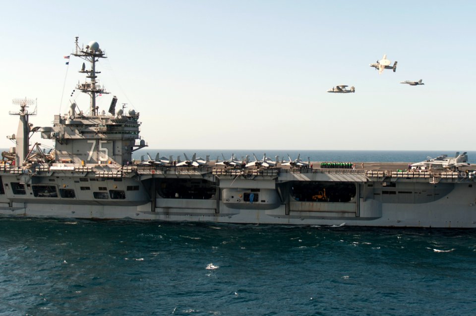A U.S. Navy E-2C Hawkeye aircraft flown by Cmdr. John Hewitt, top, the outgoing commanding officer of Carrier Airborne Early Warning Squadron (VAW) 126, an E-2C flown by Cmdr. Przemyslaw Kaczynski, left 140318-N-ZG705-048