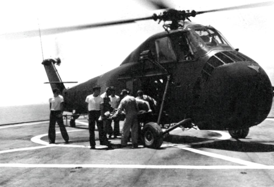 A U.S. Marine Corps Sikorsky UH-34D delivers patients to ship USS Sanctuary (AH-17) off Vietnam, in 1967